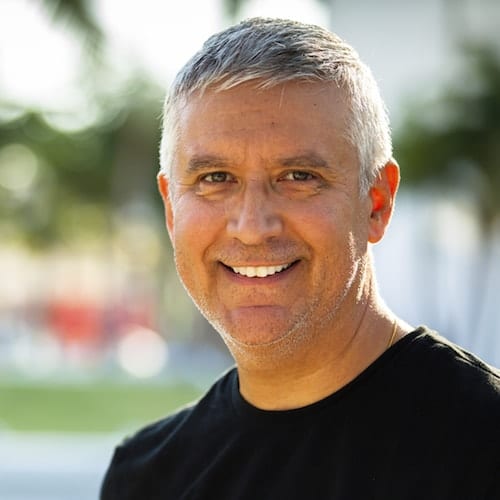 Palm Beach Gardens Cosmetic Dentistry - Crowns A man who has had a crown as part of Palm Beach Gardens Cosmetic Dentistry