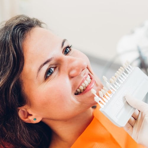 Palm Beach Gardens Cosmetic Dentistry - Teeth Whitening A woman getting whitening as part Palm Beach Gardens Cosmetic Dentistry