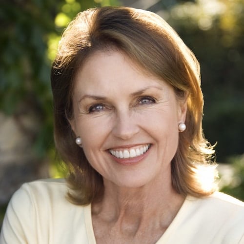 Restorative Dentistry Palm Beach Gardens - Dentures An older woman with dentures and Restorative Dentistry Palm Beach Gardens