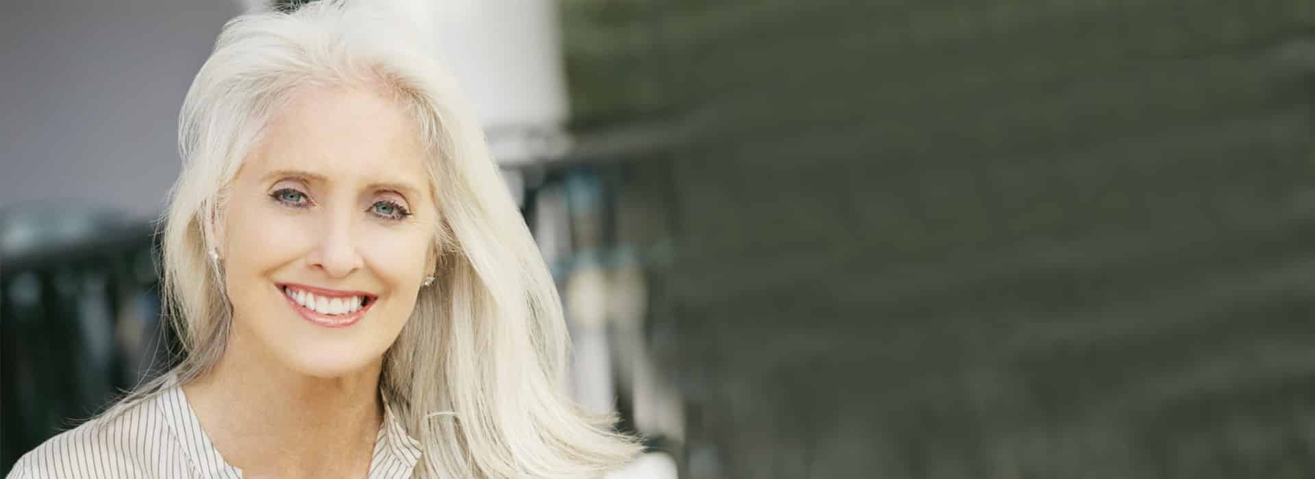 Dental implants Palm Beach Gardens patient Older lady who has had dental implants in Palm Beach Gardens