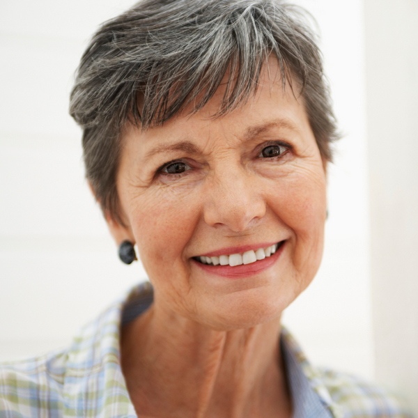 Elderly woman with a short hair is smiling