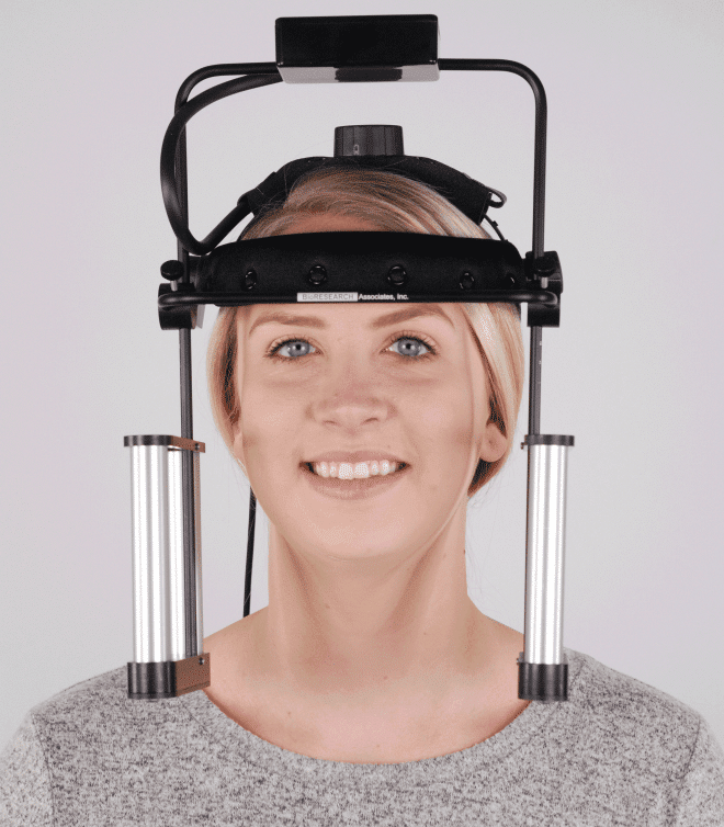 A woman is wearing a jaw-tracker